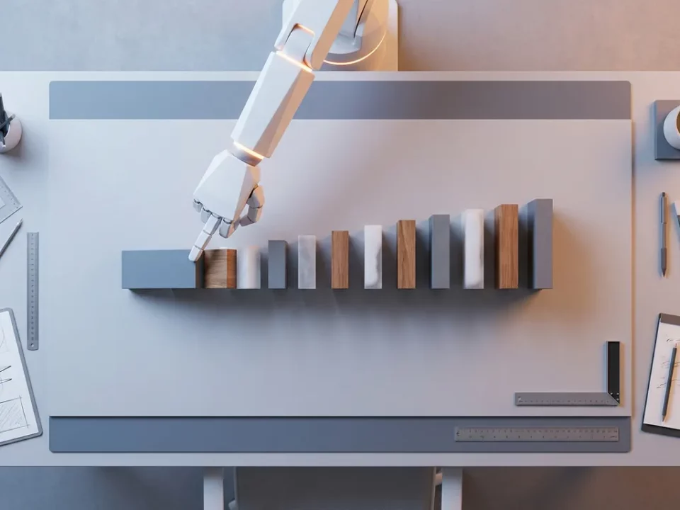 Witte robotarm duwt de eerste dominosteen in een groeiende rij blokken, studiobelichting van bovenaf.