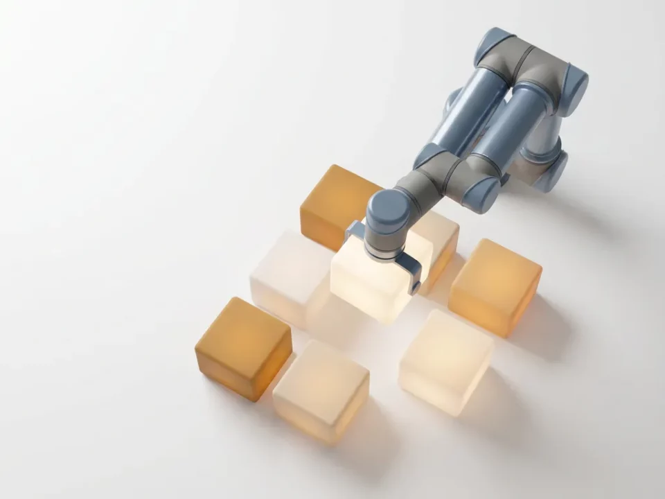 Robotarm monteert gloeiende modulaire blokken op wit oppervlak, 3D-render in leisteenblauw en amber, bovenaanzicht.